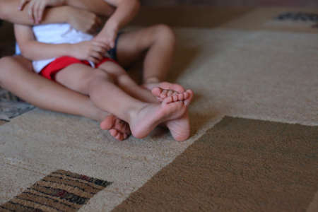 baby foot in the hands of parentsの写真素材