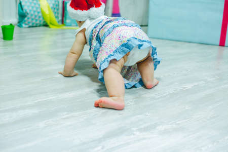 Close up photo from a baby's leg in her mother's handの写真素材