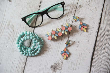 various women's accessories on wooden backgroundの写真素材