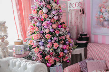 Christmas home decoration with tree, gifts and fireplace.の写真素材