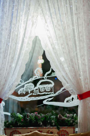 Christmas tree seen through a windowの写真素材