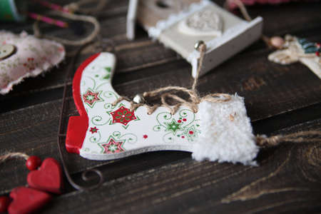 advent wreath with first burning candle on rustic old wooden tableの写真素材