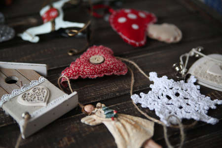 advent wreath with first burning candle on rustic old wooden tableの写真素材