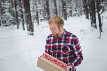 Men hands hold Christmas gift