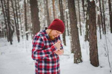 birch winter forest man with axeの写真素材