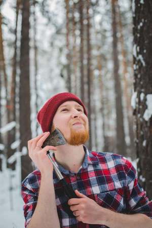 birch winter forest man with axe