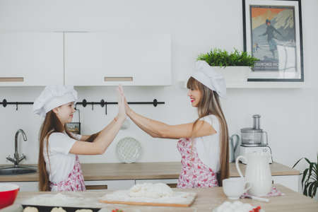 Mother and daughter to cook sconesの写真素材