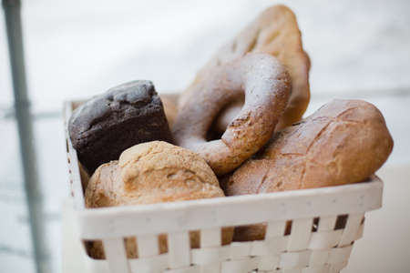 Modern bakery with assortment of bread, cakes and bunsの写真素材