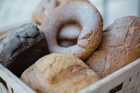 Modern bakery with assortment of bread, cakes and bunsの写真素材