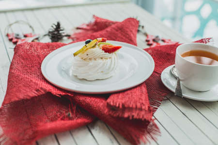 Beautiful white dessert on a red napkinの写真素材