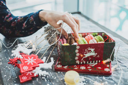 Christmas macarons with a crushed candy cane fillingの写真素材