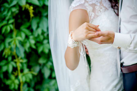 Bride and groom holding hands