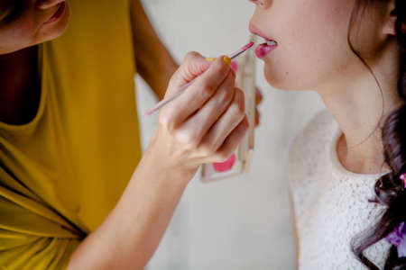 Wedding makeup artist making a make up for brideの写真素材