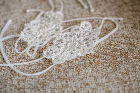 Delicate detail of a wedding dress. Fine lace.