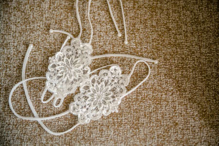 Delicate detail of a wedding dress. Fine lace.の写真素材