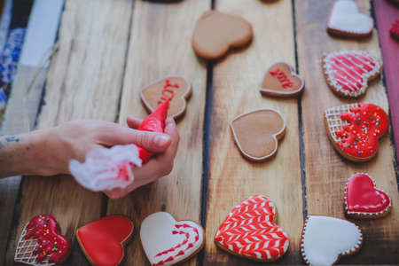 Red heart cookies on wooden background Valentines dayの写真素材