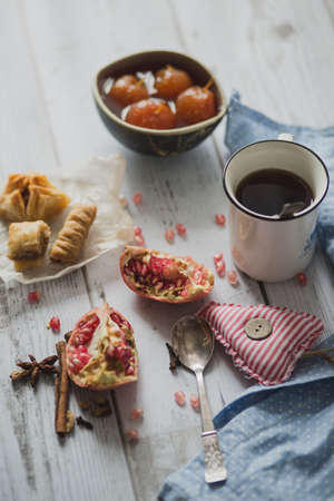 tea, fruit, fabric on wooden backgroundの写真素材