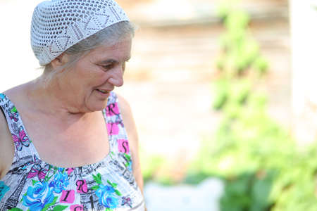 an elderly woman in the garden outdoors