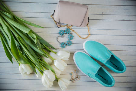 Female shoes with flowers on wooden backgroundの写真素材