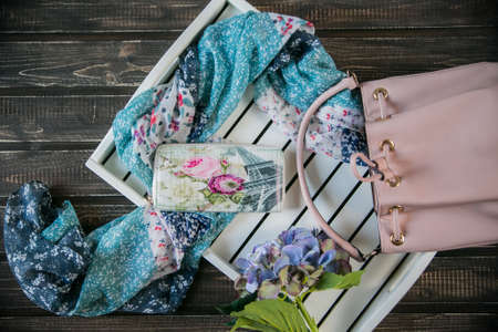 womens accessories, shoes lying on wooden backgroundの写真素材