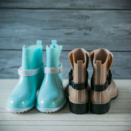 rubber boots on wooden backgroundの写真素材