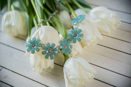 Beautiful female bracelet with stones, beads and flowersの写真素材