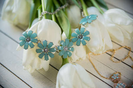 Beautiful female bracelet with stones, beads and flowersの写真素材