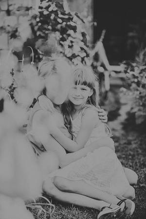 Happy loving family. Mother and daughter on the street embracingの写真素材