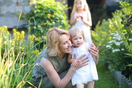 Happy loving family. Mother and daughter on the street embracing