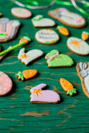 Easter gingerbread cookies in the shape of hares and carrotsの写真素材