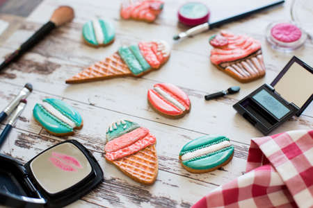 gingerbread in the form of ice cream and macaron on wooden backgroundの写真素材