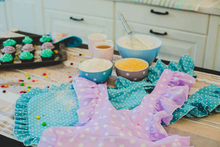 colorful cupcakes are on the trayの写真素材
