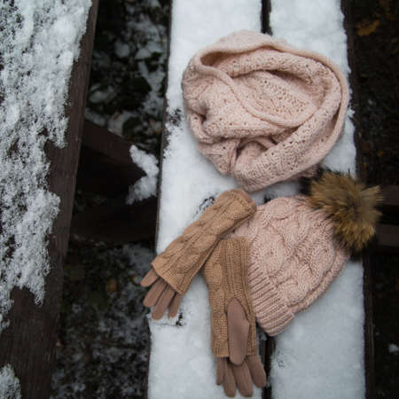 woolen light blue scarf, gloves and hat over whiteの写真素材