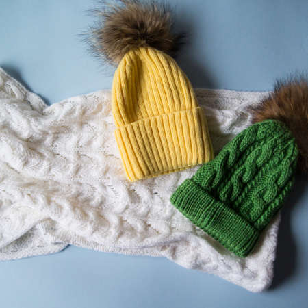 woolen light blue scarf, gloves and hat over whiteの写真素材