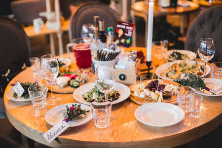 festively decorated table in the interior of the restaurantの写真素材