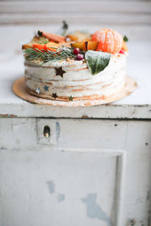 Christmas cake on a stand on the background