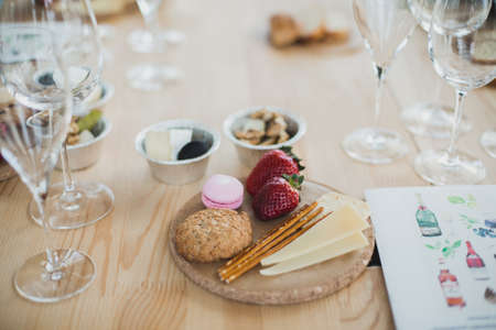 Table setting with wine and snacks, etiquette and eventの写真素材