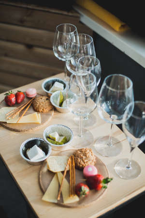 Table setting with wine and snacks, etiquetteの写真素材