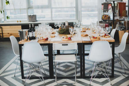 Table setting with wine and snacks, etiquetteの写真素材