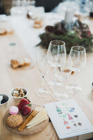 Table setting with wine and snacks, etiquetteの写真素材