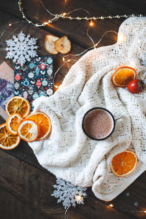 dried orange slices, christmas decor. white plaid with a garland. close-up