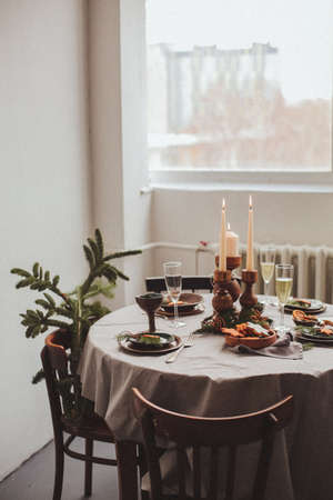 Table served for Christmas dinner in living room, close up view.の写真素材