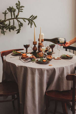 Table served for Christmas dinner in living room, close up view.の写真素材