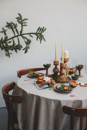 Table served for Christmas dinner in living room, close up view.の写真素材
