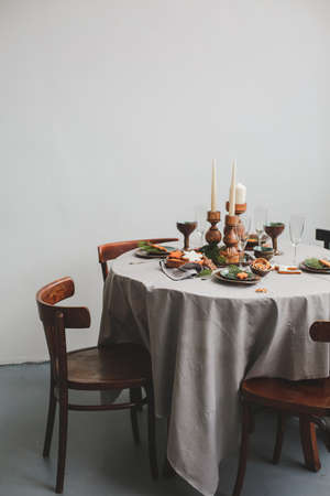 Table served for Christmas dinner in living room, close up view.の写真素材
