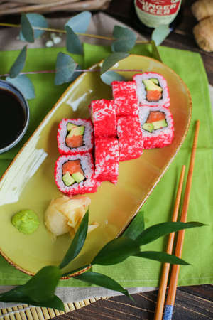 sushi with salmon and avocado. Sushi roll with salmon and tempura shrimpの写真素材