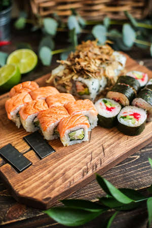 sushi with salmon and avocado. Sushi roll with salmon and tempura shrimpの写真素材