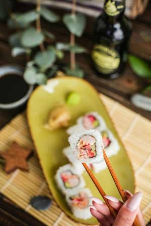 sushi with salmon and avocado. Sushi roll with salmon and tempura shrimpの写真素材
