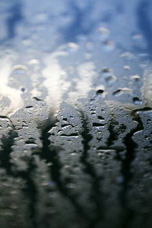 Water drops colorful macro droplets on windowの写真素材