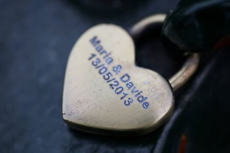 Heart lock with names in Amsterdam macro background high qualityの写真素材